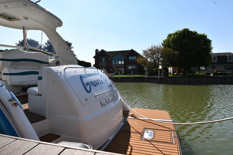 Slide: The Image of 2006 Formula 40 Performance Cruiser docked by waterfront homes on a sunny day. - 6