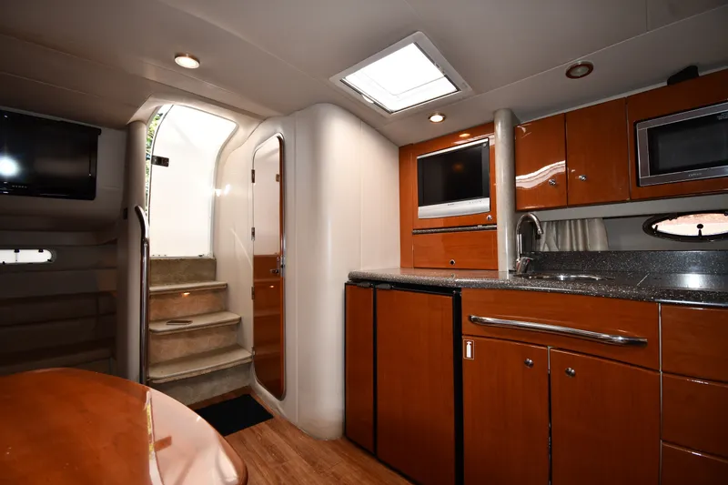 Slide: The Image of Interior of a 2006 Formula 40 Performance Cruiser with modern kitchen and entertainment area. - 36
