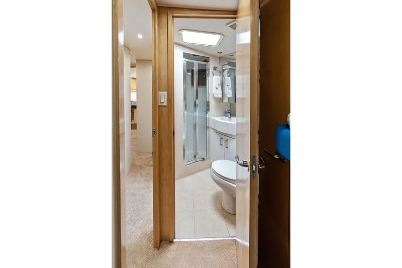 Slide: The Image of Bathroom interior of 1999 Hatteras 60 Convertible yacht, featuring shower and sink. - 44