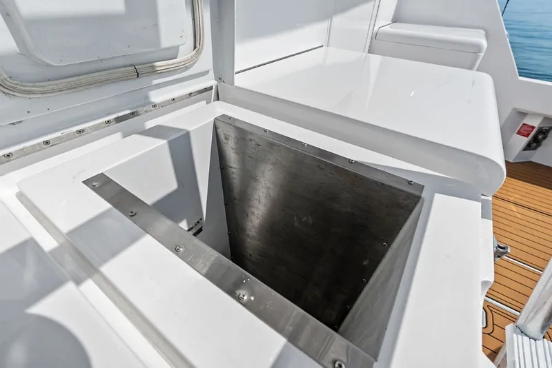 Slide: The Image of Open storage compartment on 1999 Hatteras 60 Convertible yacht deck. - 21
