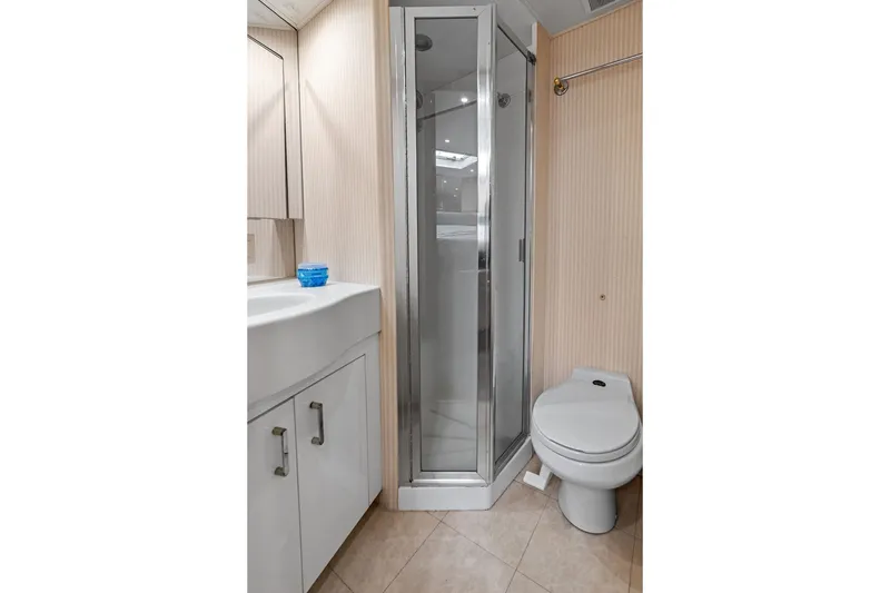 Slide: The Image of Bathroom interior of 1999 Hatteras 60 Convertible yacht with shower and toilet. - 57