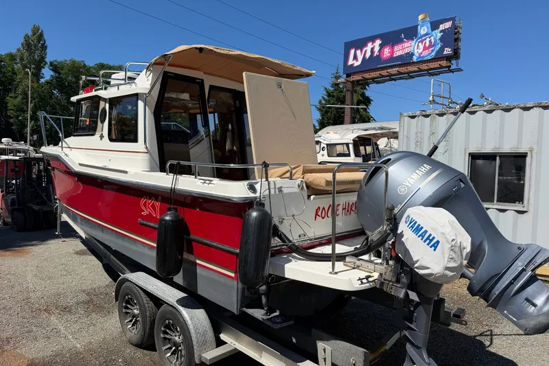 Slide: The Image of 2017 Ranger Tugs R-23 boat with Yamaha engine on trailer, parked outdoors. - 7