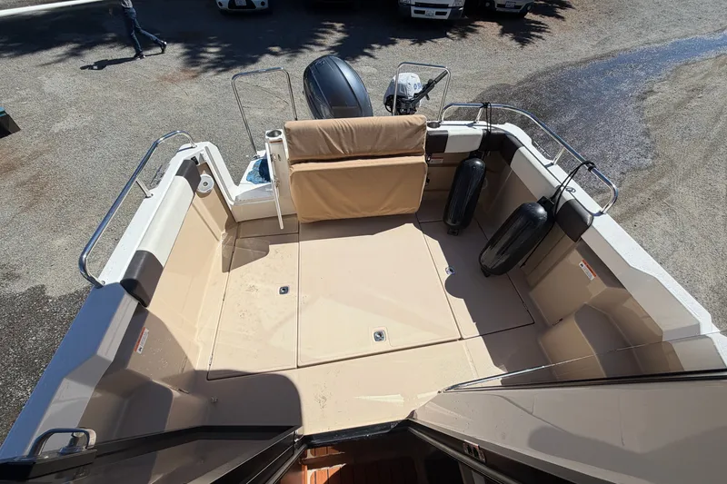 Slide: The Image of 2017 Ranger Tugs R-23 boat deck with seating and protective fenders. - 10