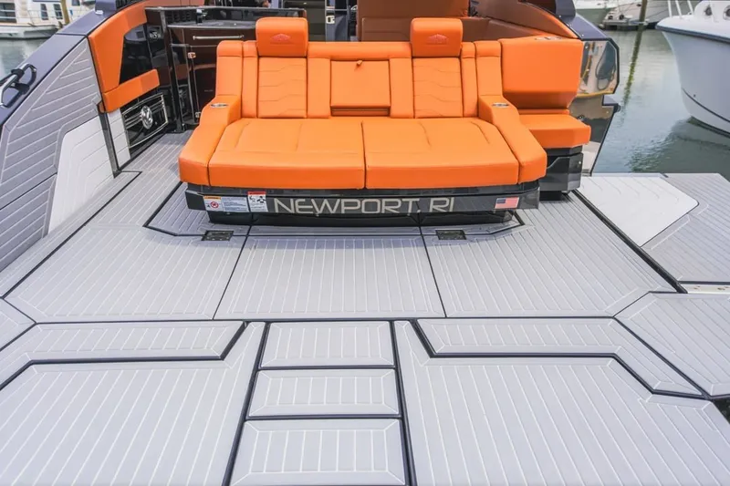 Slide: The Image of 2022 Cruisers Yachts 42 GLS I/O with orange seating and spacious deck in Newport, RI marina. - 77