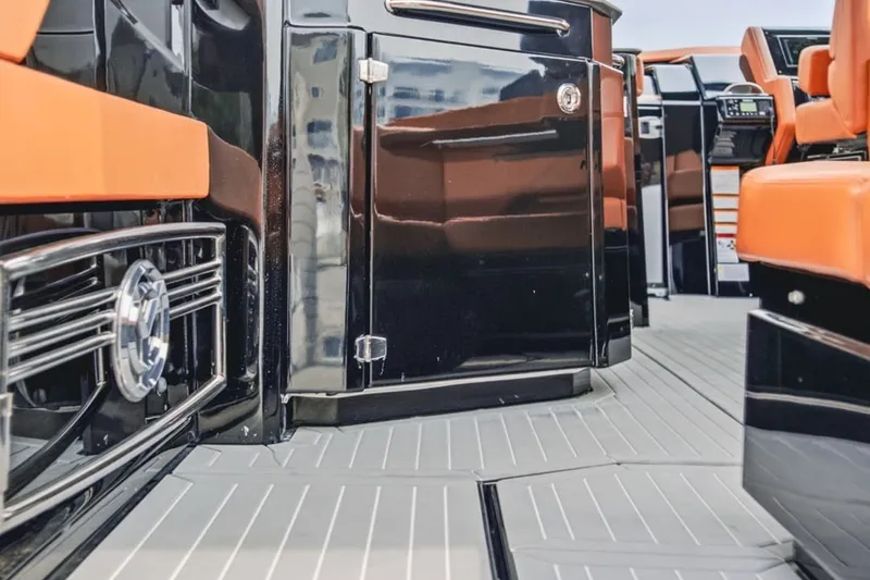 Slide: The Image of Interior view of 2022 Cruisers Yachts 42 GLS I/O with sleek black and orange design. - 47