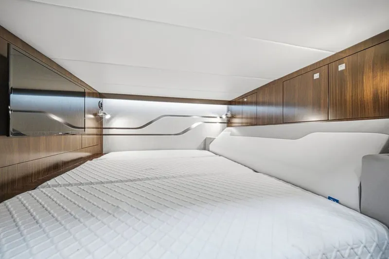 Slide: The Image of Luxurious cabin interior of 2022 Cruisers Yachts 42 GLS I/O with modern wood finishes. - 26