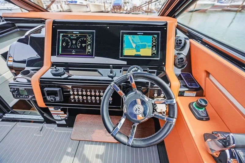 Slide: The Image of Helm of 2022 Cruisers Yachts 42 GLS I/O with modern navigation displays. - 43