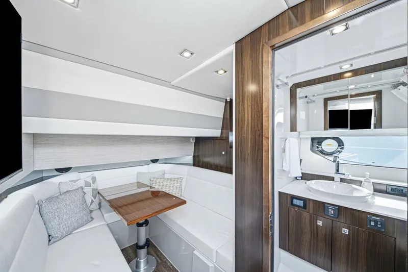 Slide: The Image of Luxurious interior of 2022 Cruisers Yachts 42 GLS I/O with modern seating and bathroom. - 21