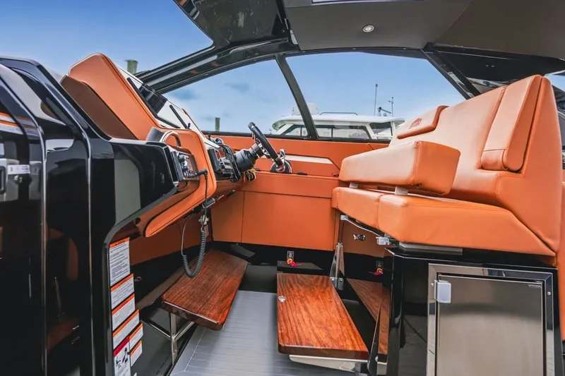 Slide: The Image of Luxurious 2022 Cruisers Yachts 42 GLS I/O interior with sleek design and plush seating. - 64