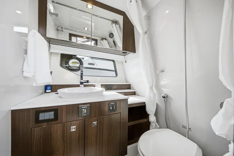 Slide: The Image of Luxurious bathroom interior of 2022 Cruisers Yachts 42 GLS I/O with modern fixtures. - 30