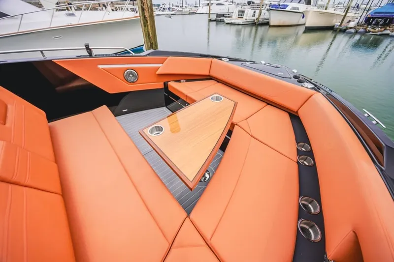 Slide: The Image of Luxurious 2022 Cruisers Yachts 42 GLS I/O with orange seating and sleek design in marina. - 61