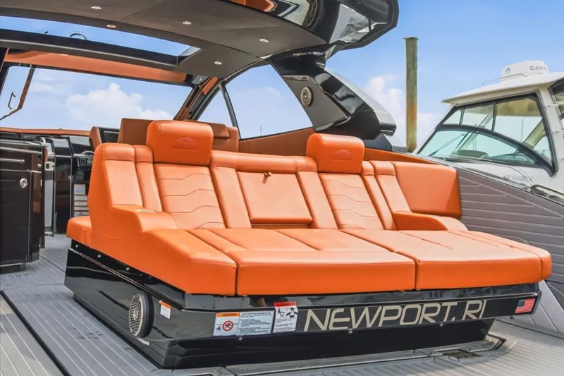Slide: The Image of 2022 Cruisers Yachts 42 GLS I/O with luxurious orange seating on deck. - 55