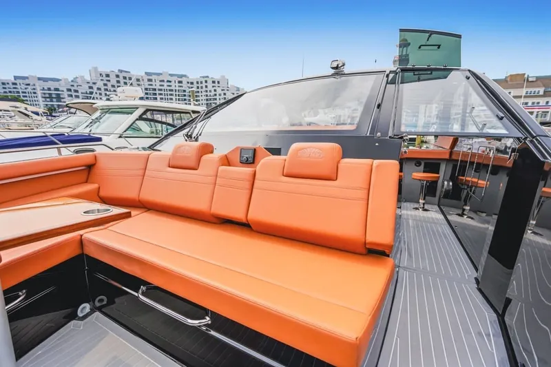 Slide: The Image of Luxurious 2022 Cruisers Yachts 42 GLS I/O with vibrant orange seating and sleek design. - 62