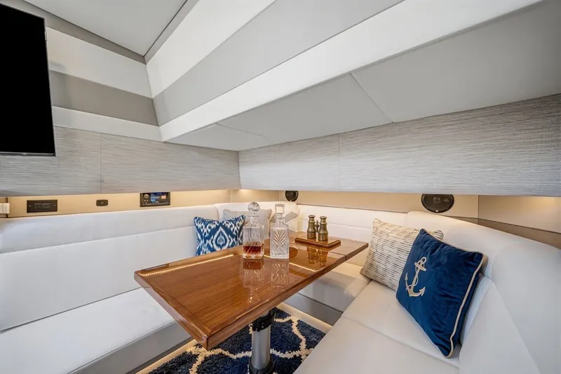 Slide: The Image of Luxurious interior of 2022 Cruisers Yachts 42 GLS I/O with elegant seating and decor. - 33