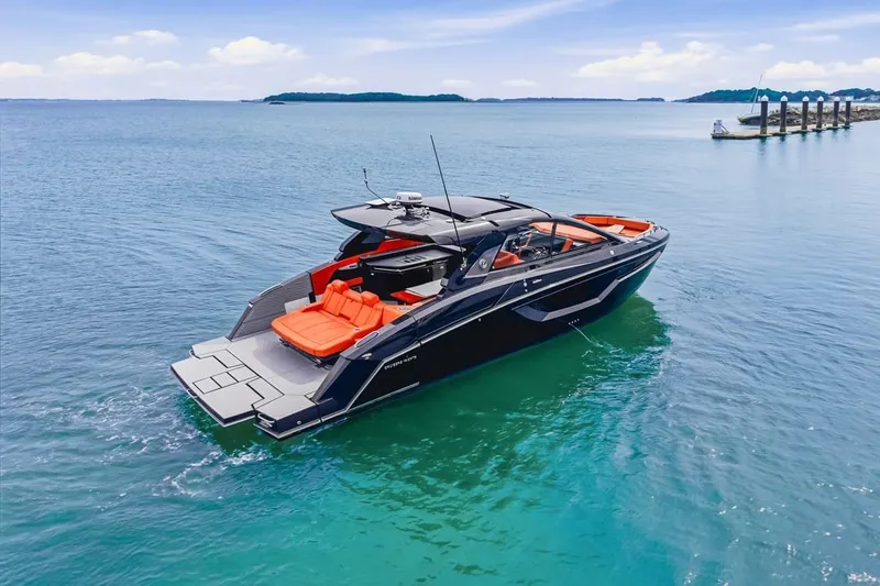 Slide: The Image of 2022 Cruisers Yachts 42 GLS I/O luxury boat on clear blue water. - 5