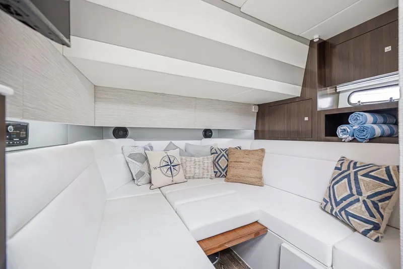 Slide: The Image of Luxurious interior of 2022 Cruisers Yachts 42 GLS I/O with plush seating and nautical decor. - 68