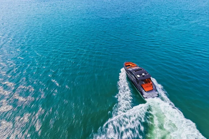 Slide: The Image of Aerial view of 2022 Cruisers Yachts 42 GLS I/O cruising on clear blue water. - 20