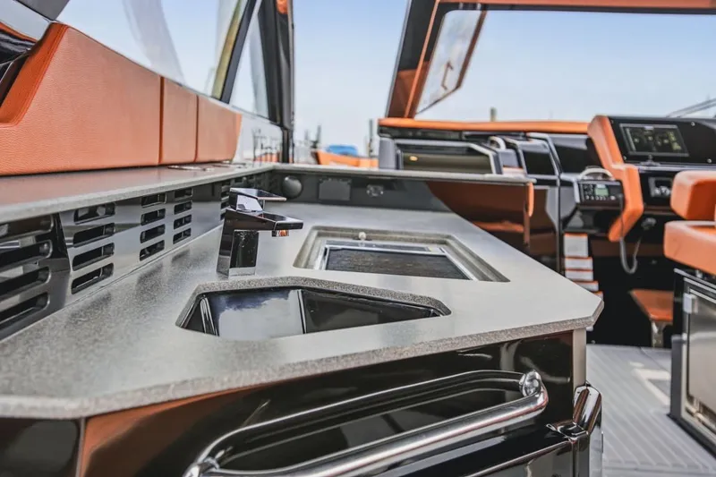 Slide: The Image of Luxurious interior of 2022 Cruisers Yachts 42 GLS I/O with modern kitchen amenities. - 46