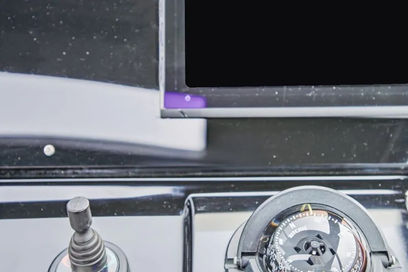 Slide: The Image of Dashboard of 2022 Cruisers Yachts 42 GLS I/O with compass and controls. - 75