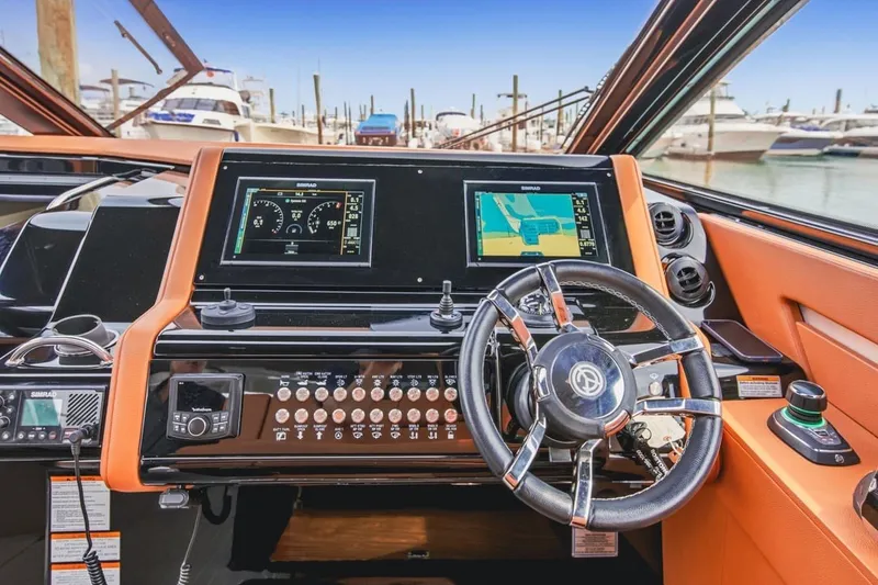 Slide: The Image of Helm of 2022 Cruisers Yachts 42 GLS I/O with advanced navigation displays. - 41
