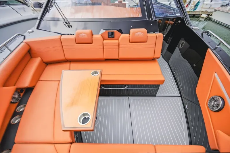 Slide: The Image of Luxurious 2022 Cruisers Yachts 42 GLS I/O with orange seating and sleek interior design. - 60