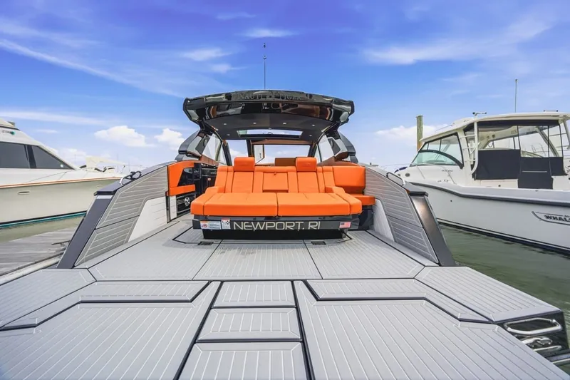 Slide: The Image of 2022 Cruisers Yachts 42 GLS I/O with orange seating, docked in Newport, RI. - 49