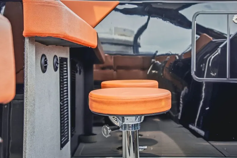 Slide: The Image of Luxury seating on 2022 Cruisers Yachts 42 GLS I/O with orange upholstery. - 51