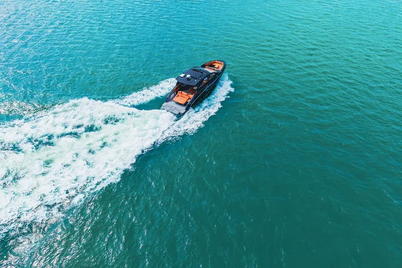 Slide: The Image of 2022 Cruisers Yachts 42 GLS I/O cruising on clear turquoise waters. - 19