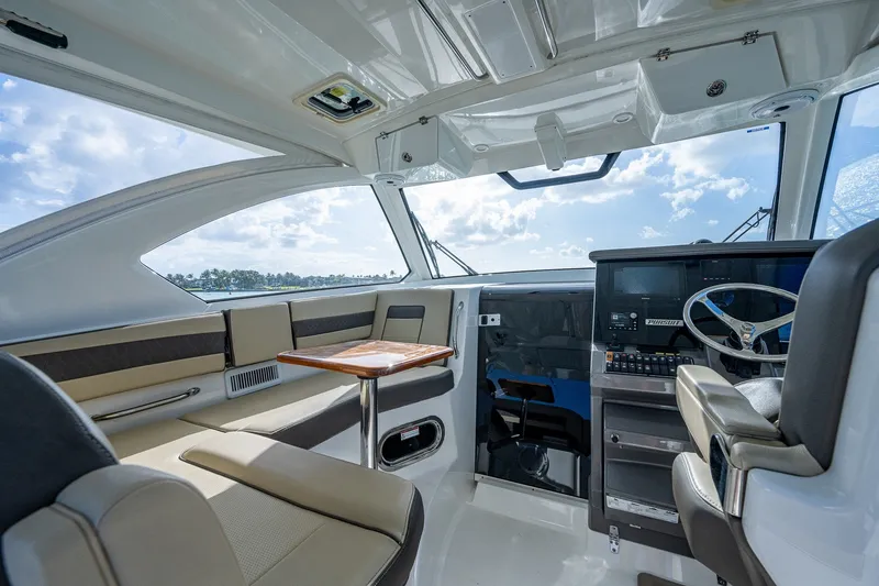 Slide: The Image of Interior of 2020 Pursuit OS 355 Offshore boat with seating and helm station. - 35