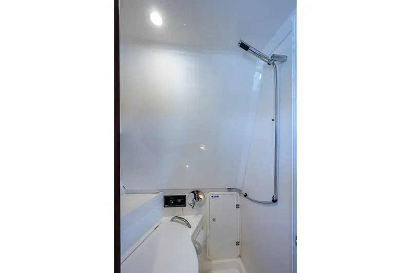 Slide: The Image of 2020 Pursuit OS 355 Offshore boat shower with sleek, modern design and chrome fixtures. - 60