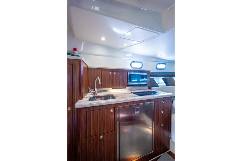 Slide: The Image of Luxurious 2020 Pursuit OS 355 Offshore yacht interior with modern kitchen amenities. - 53