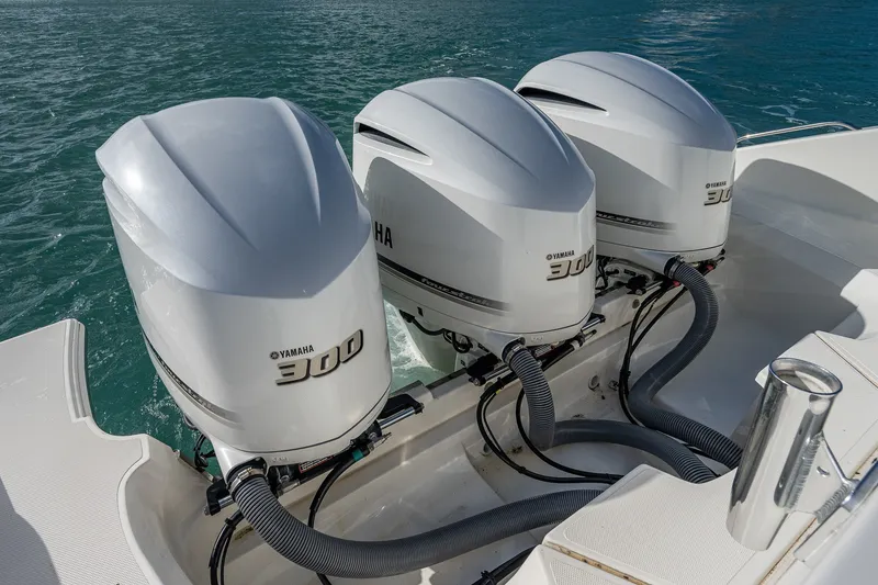 Slide: The Image of Triple Yamaha 300 outboard engines on a 2020 Pursuit OS 355 Offshore boat. - 47