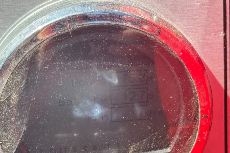 Slide: The Image of Close-up of a dusty gauge on a 2016 KingFisher 2025 Discovery boat. - 30