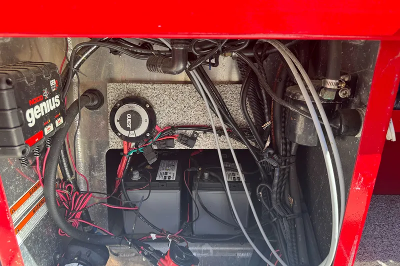 Slide: The Image of Electrical compartment of a 2016 KingFisher 2025 Discovery boat with wiring and battery setup. - 31