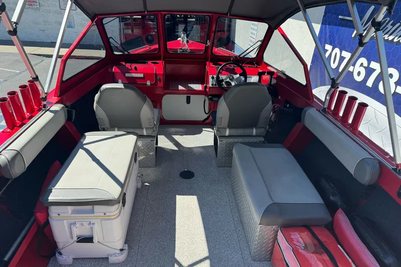 Slide: The Image of Interior of a 2016 KingFisher 2025 Discovery boat with seating and storage. - 11