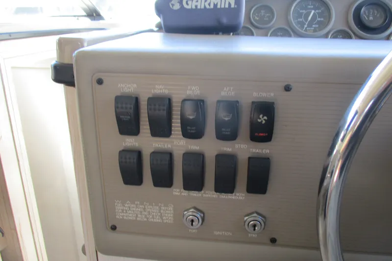 Slide: The Image of Control panel of a 1995 Bayliner 3258 Avanti boat with various switches and gauges. - 31