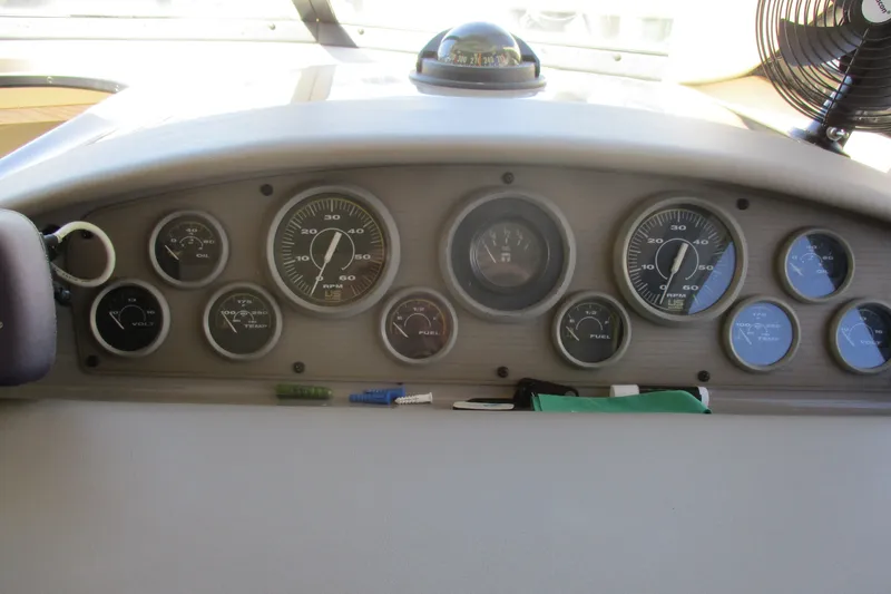Slide: The Image of Dashboard of a 1995 Bayliner 3258 Avanti boat with various gauges and controls. - 28