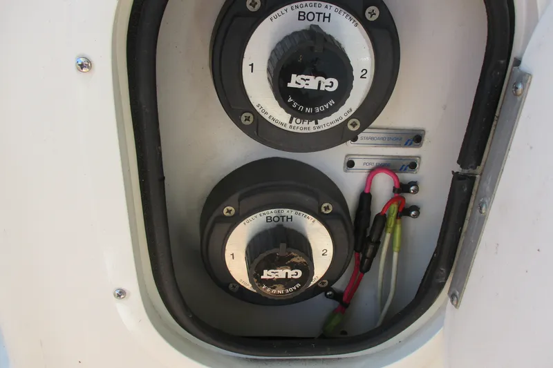 Slide: The Image of Battery switches on a 1995 Bayliner 3258 Avanti boat, labeled for port and starboard engines. - 56