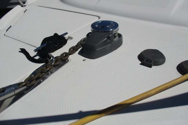 Slide: The Image of Anchor chain and winch on 1995 Bayliner 3258 Avanti boat deck. - 11