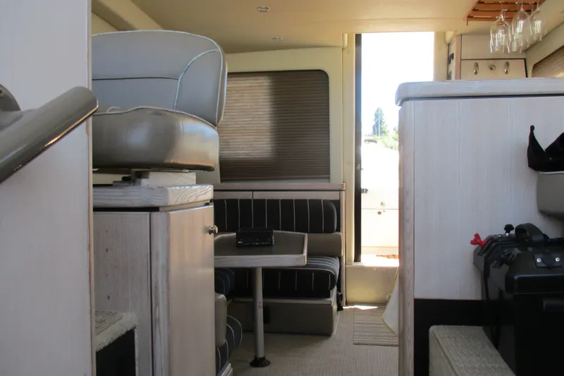 Slide: The Image of Interior of 1995 Bayliner 3258 Avanti boat with seating and helm station. - 38