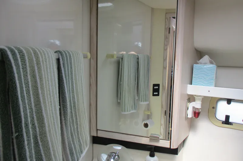 Slide: The Image of Bathroom interior of 1995 Bayliner 3258 Avanti with towels and toiletries. - 47