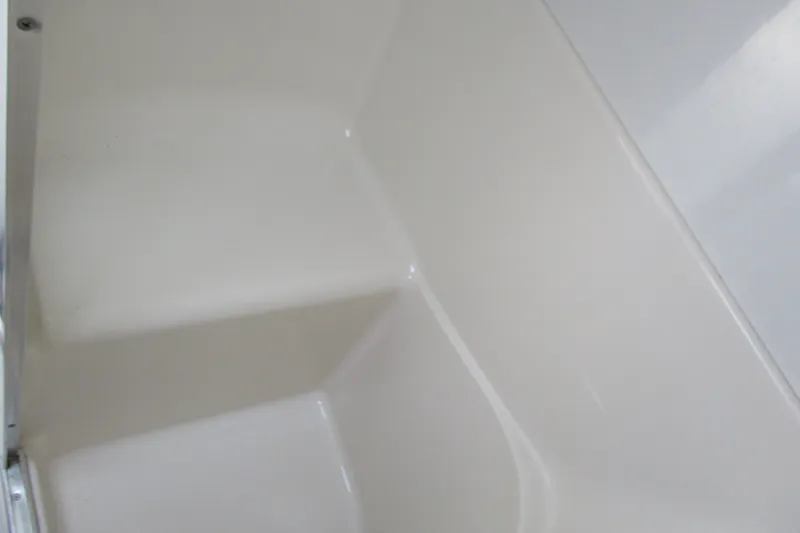 Slide: The Image of Interior of 1995 Bayliner 3258 Avanti boat, featuring a clean, white fiberglass surface. - 51