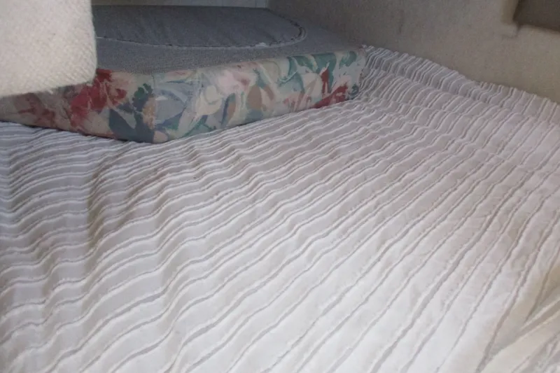 Slide: The Image of Interior cabin bed of 1995 Bayliner 3258 Avanti with floral-patterned mattress. - 40