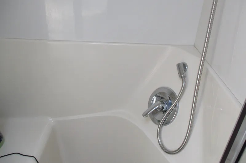 Slide: The Image of Shower area in 1995 Bayliner 3258 Avanti boat with chrome fixtures. - 50