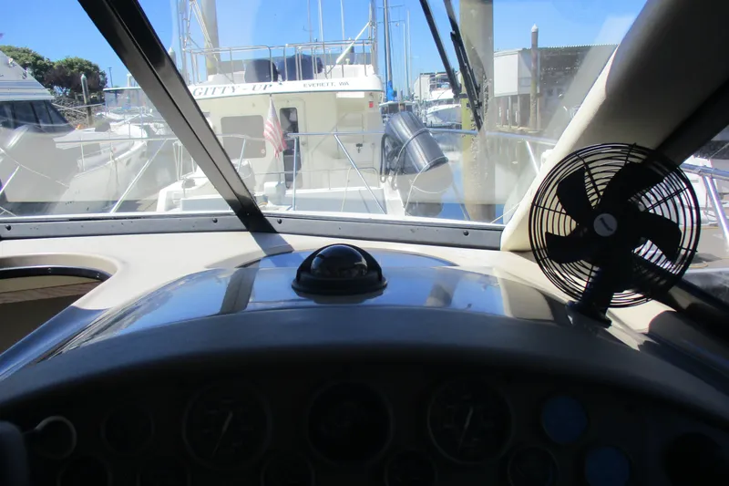 Slide: The Image of Interior view of 1995 Bayliner 3258 Avanti cockpit with dashboard and fan. - 34