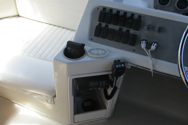 Slide: The Image of 1995 Bayliner 3258 Avanti cockpit with control panel and seating area. - 22