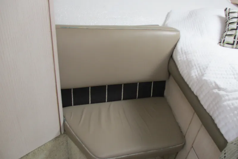 Slide: The Image of Interior seating area of 1995 Bayliner 3258 Avanti boat, featuring beige upholstery. - 41