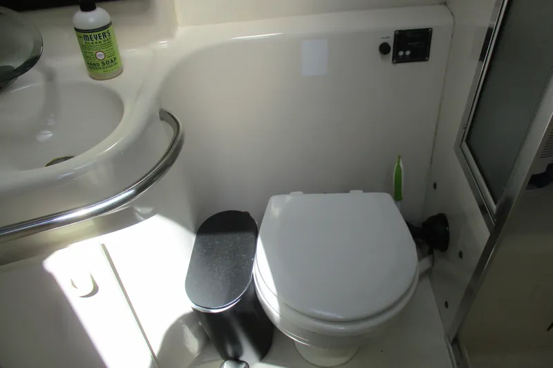 Slide: The Image of Compact bathroom in 1995 Bayliner 3258 Avanti yacht with toilet and sink. - 48