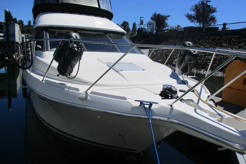 Slide: The Image of 1995 Bayliner 3258 Avanti boat docked, featuring sleek design and modern amenities. - 1
