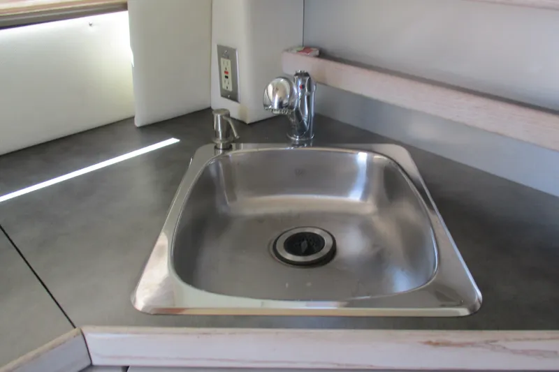 Slide: The Image of Stainless steel sink in 1995 Bayliner 3258 Avanti boat kitchen area. - 25
